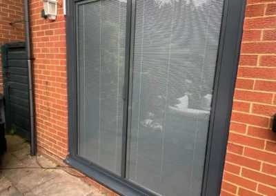 258 bifold door with thin frames and integral blinds SunSeeker Doors